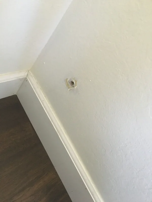 Drywall patch blended into the surrounding wall