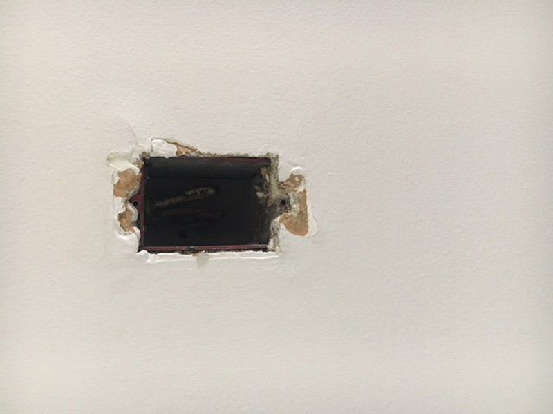 Drywall hole repair in progress