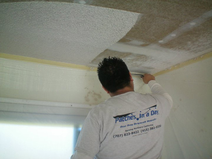 Skim coating and texturing drywall repair